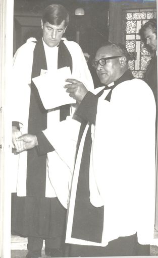 Clergymen (? and Rev. T.P. Panapa) blessing church entrance