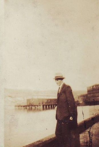 Man (unidentified) at unidentified wharf