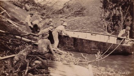 Launching wooden boat built on site, 1922