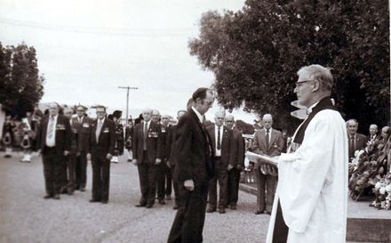Ted Lyon and unidentified man have laid wreath, Anzac Day mid 1970's