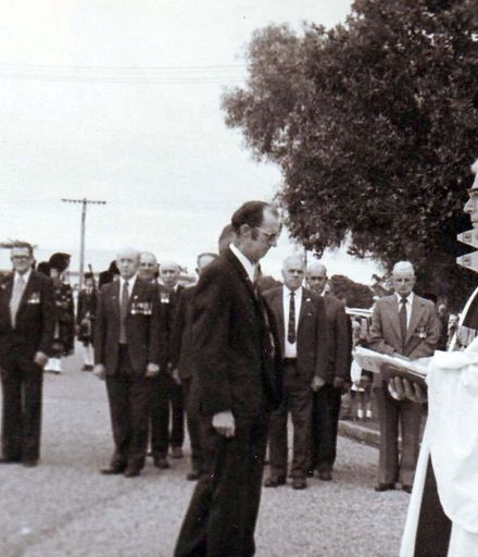 Ted Lyon and unidentified man have laid wreath, Anzac Day mid 1970's