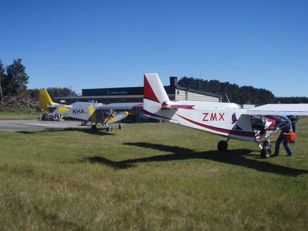 Two CH701 re-feuling at Foxpine airfield on way to Raglan from Motueka 10-11-2012