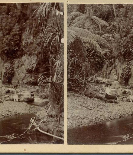 Picnic scene - 2 women (unidentified) sitting beside river, Mangaore, 1907