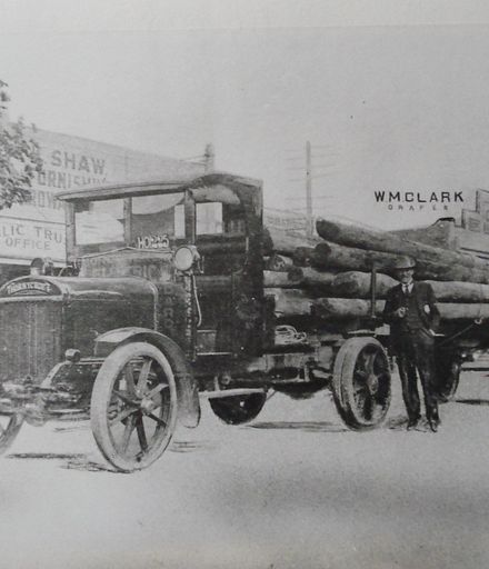 Thornycroft truck with load of wooden power poles, c.1923