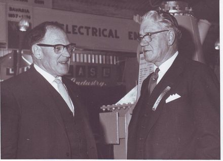 2 men near Textiles display, Electricity Exhibition 1972