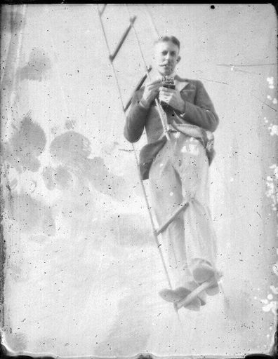 Man on a rope ladder