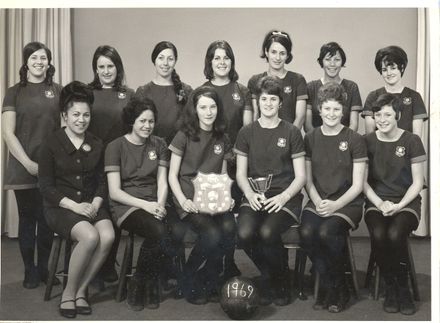 Rahui women's netball team with cup & shield, 1969