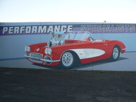 Nice wall painting on wall of Smith Automotive painted by J. S. Logie 1999.