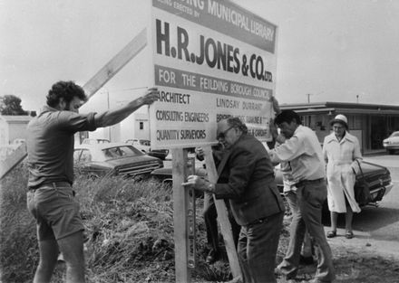 Erecting sign for new library : 61-3