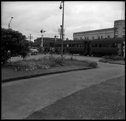 Train passing through The Square in front of the Commercial Hotel - Resource cover image