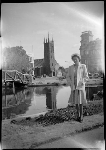 Woman standing in front of the Buttlerfly Lake in The Square, All Saints' Church behind - Resource cover image