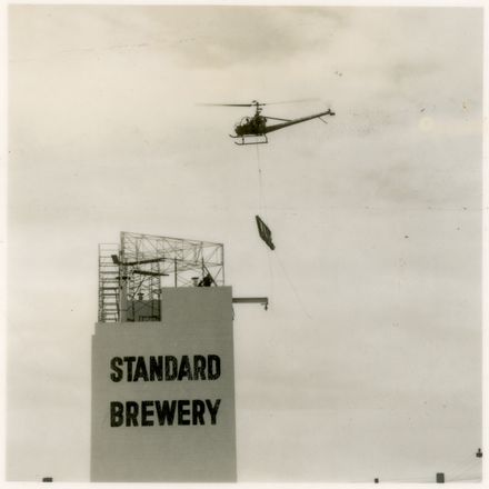 2021P_LionBreweries2-6-1_036070_007 - Helicopter Used in Installation of Standard Brewery Sign